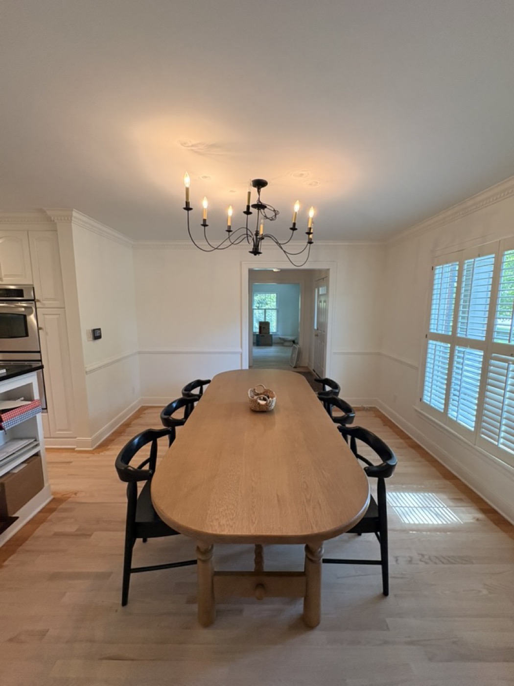 Dining room with painted walls and wainscoting trim